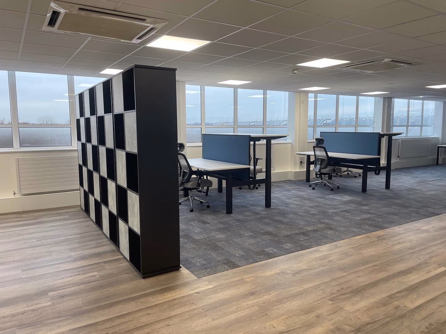 Height adjustable desks with storage room divider Height adjustable desks with storage room divider