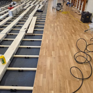 Timber sprung floor to state school sports hall Timber sprung floor to state school sports hall